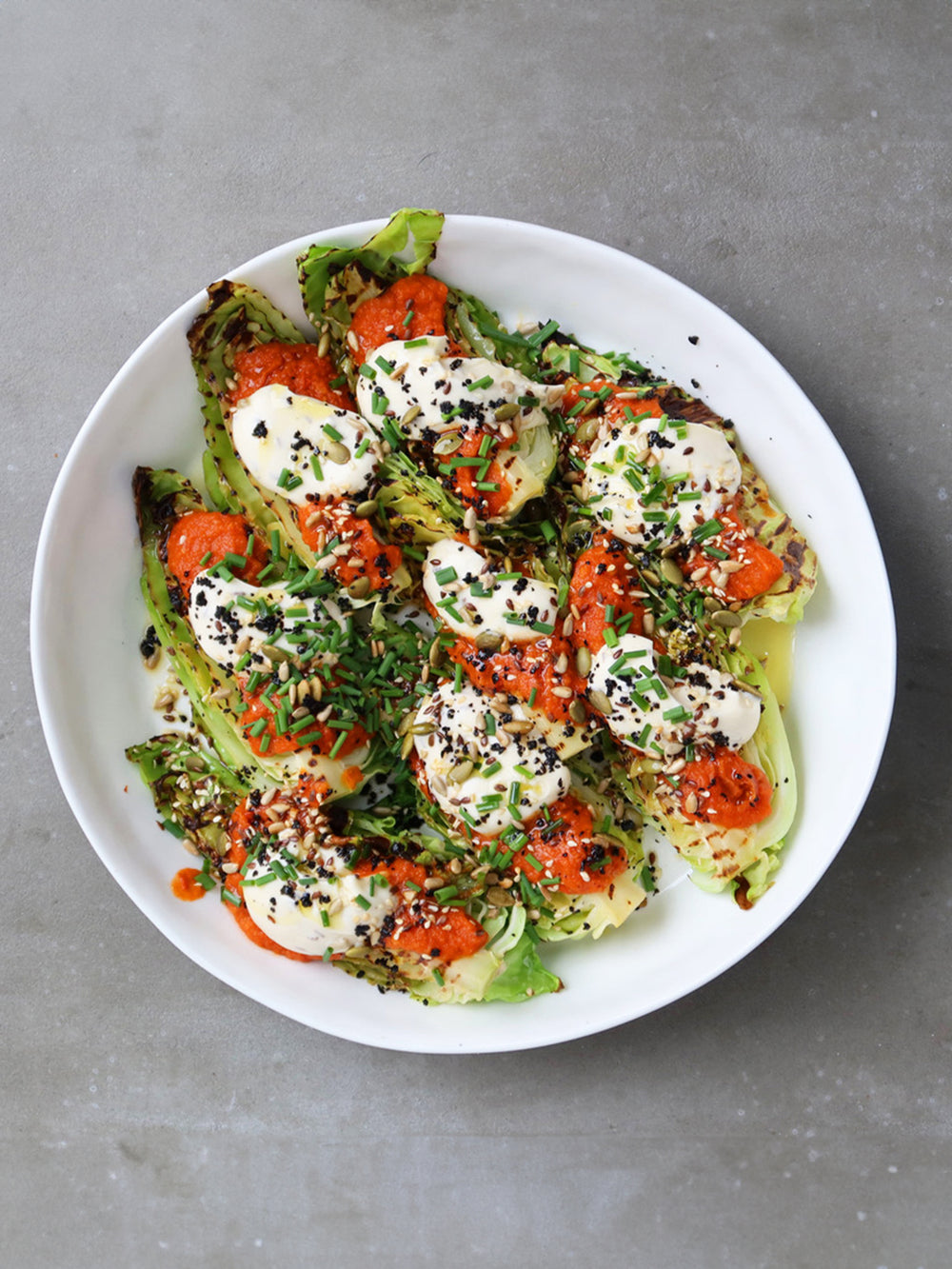 Charred hispi cabbage with tomato sauce and caraway mayo