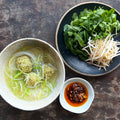 Chicken dumplings in broth, with noodles and chilli oil