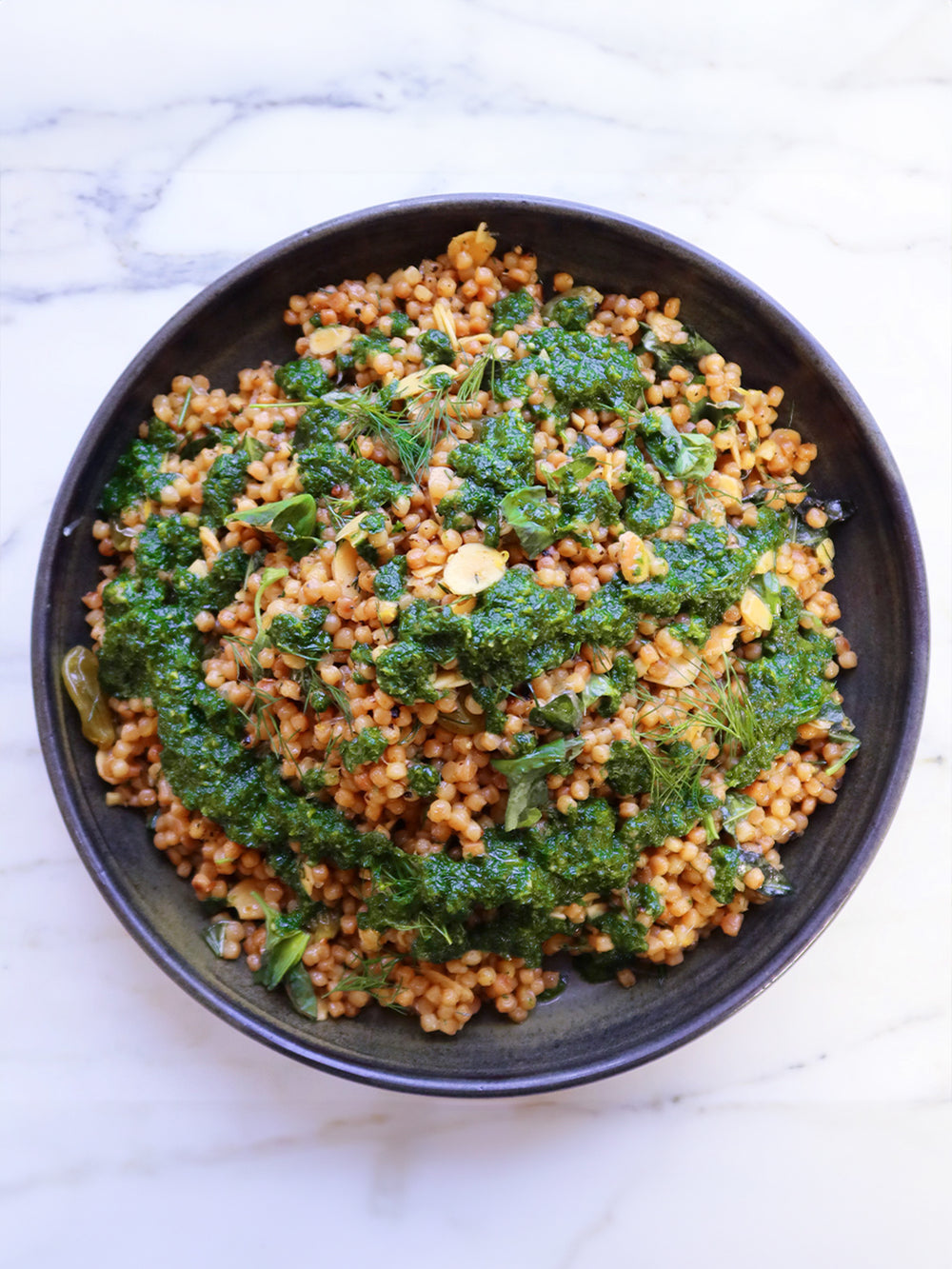 Giant couscous with golden raisins, lemon and almonds-image