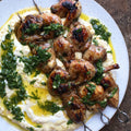 Hummus with grilled quail, pomegranate molasses and parsley salsa