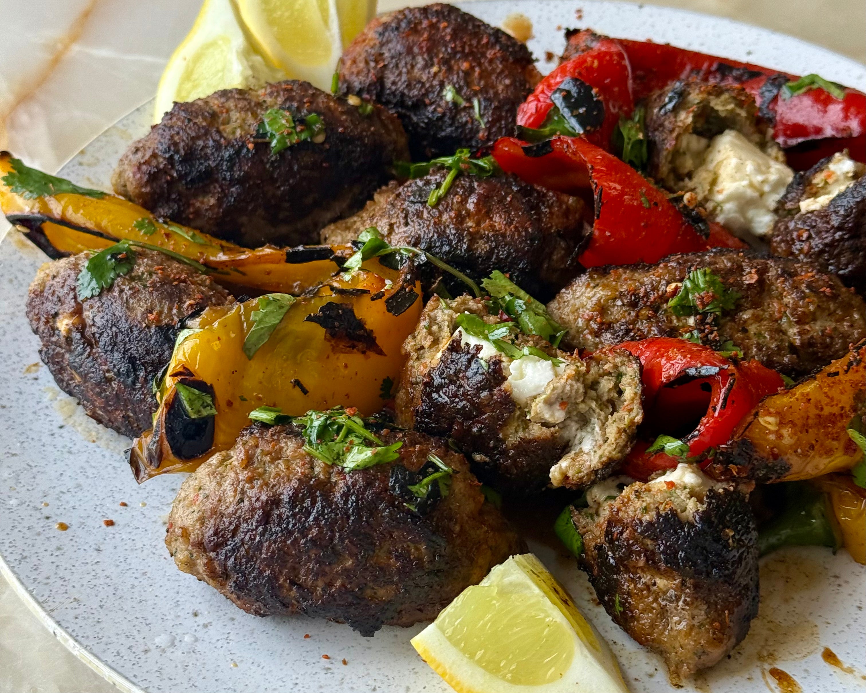 Feta-stuffed koftas with grilled peppers