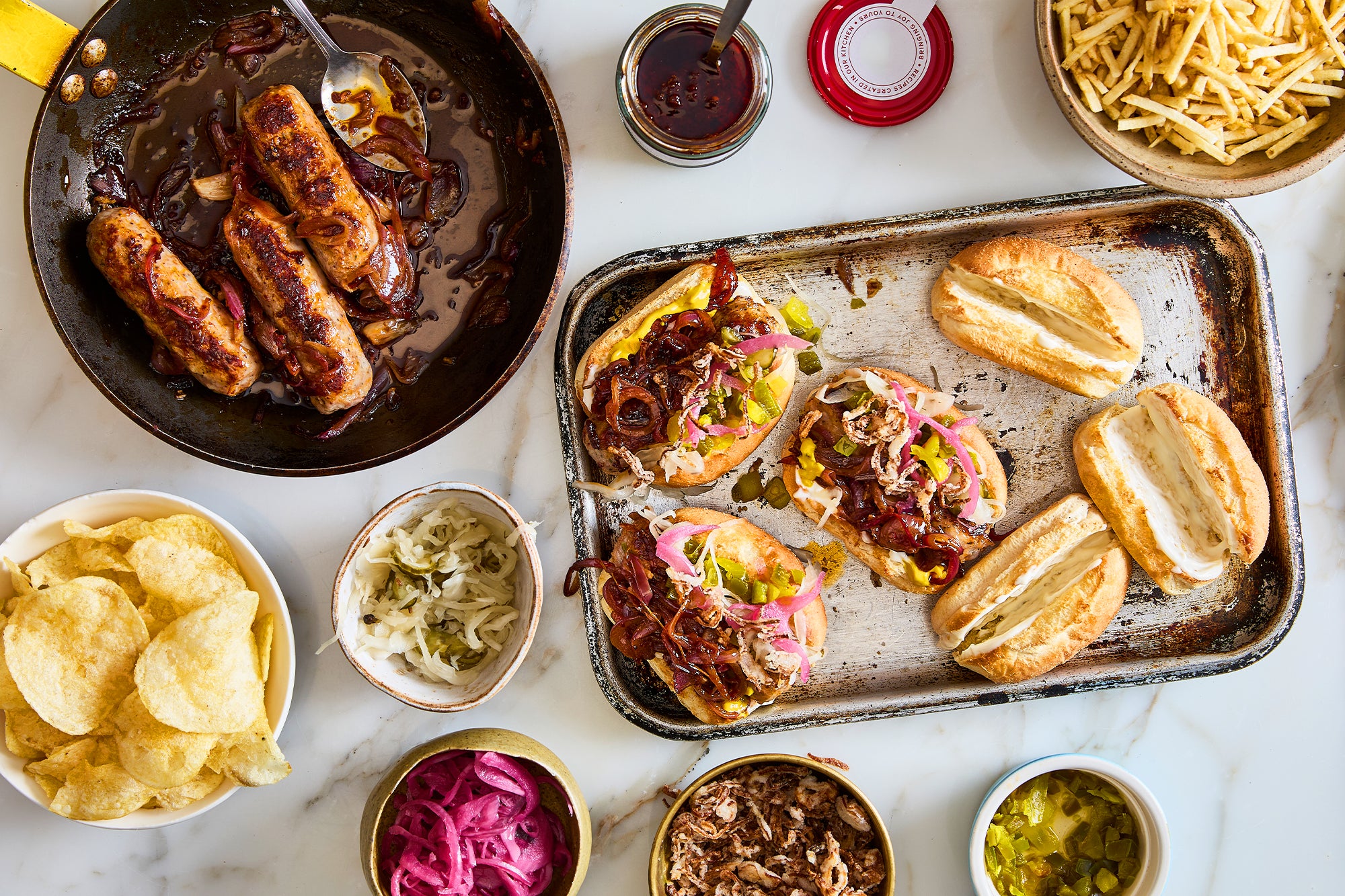 Pomegranate and lemon harissa sticky sausages