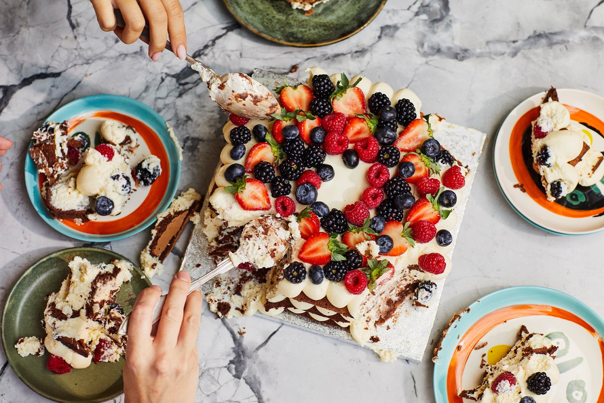 A flourless chocolate celebration cake with mascarpone cream and fresh berries