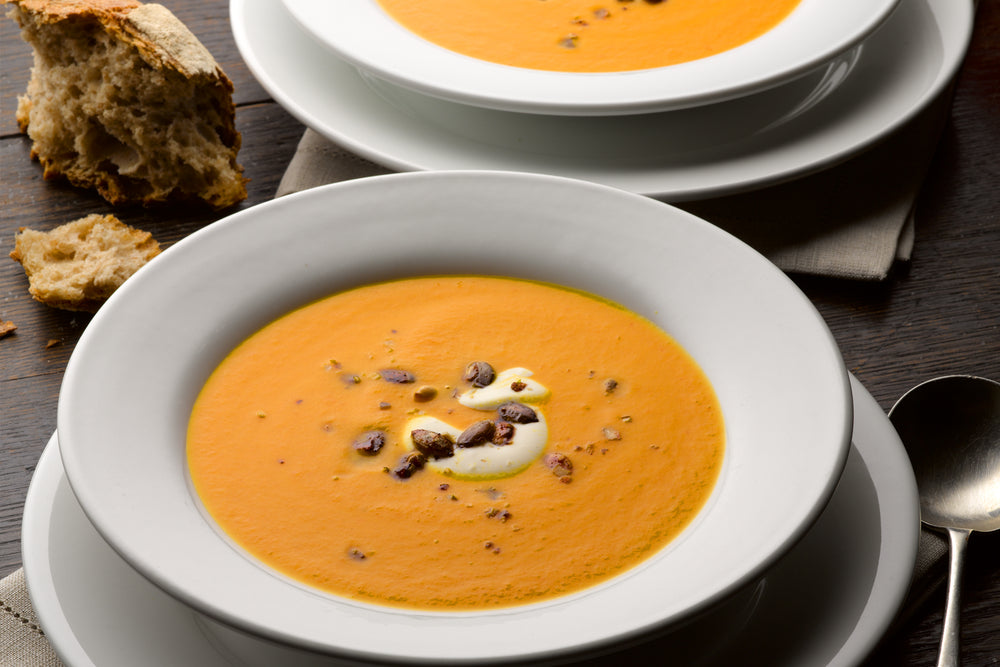 Pumpkin, saffron and orange soup with caramelised pumpkin seeds
