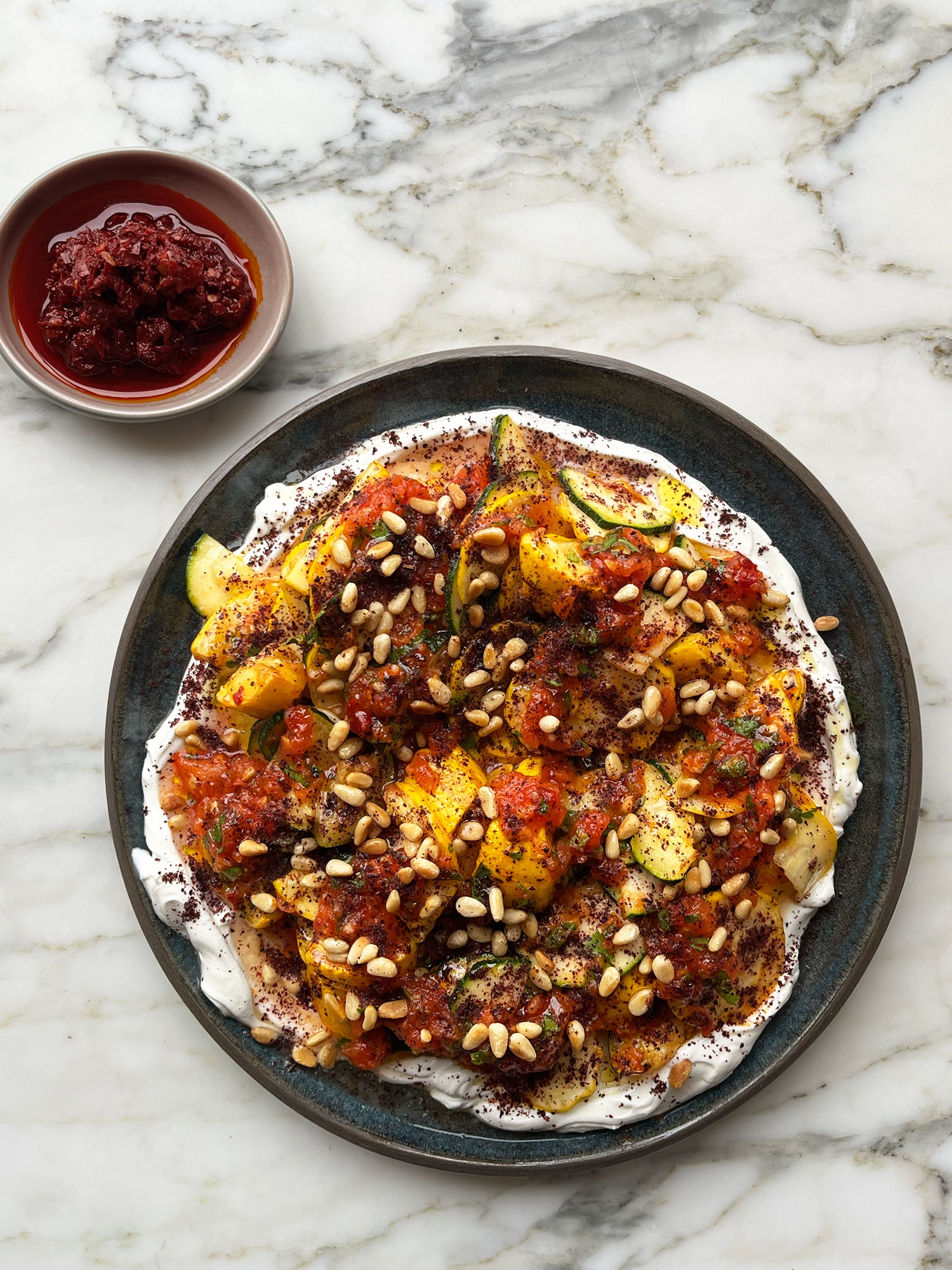 Roasted and raw courgettes with tomato salsa and labneh