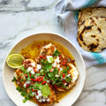 Slow-cooked hake in cascabel oil with corn tortillas