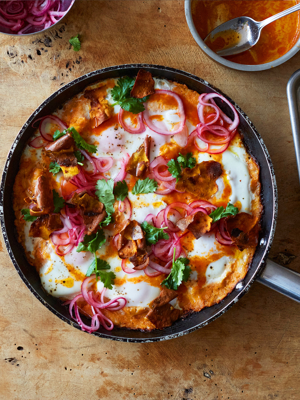 Sweet potato shakshuka with sriracha butter and pickled onions-image