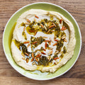 Tahini and green chilli shattah hummus topping