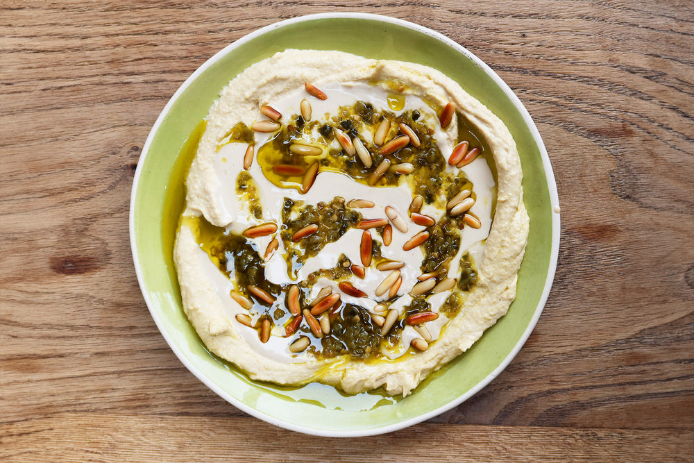 Tahini and green chilli shattah hummus topping