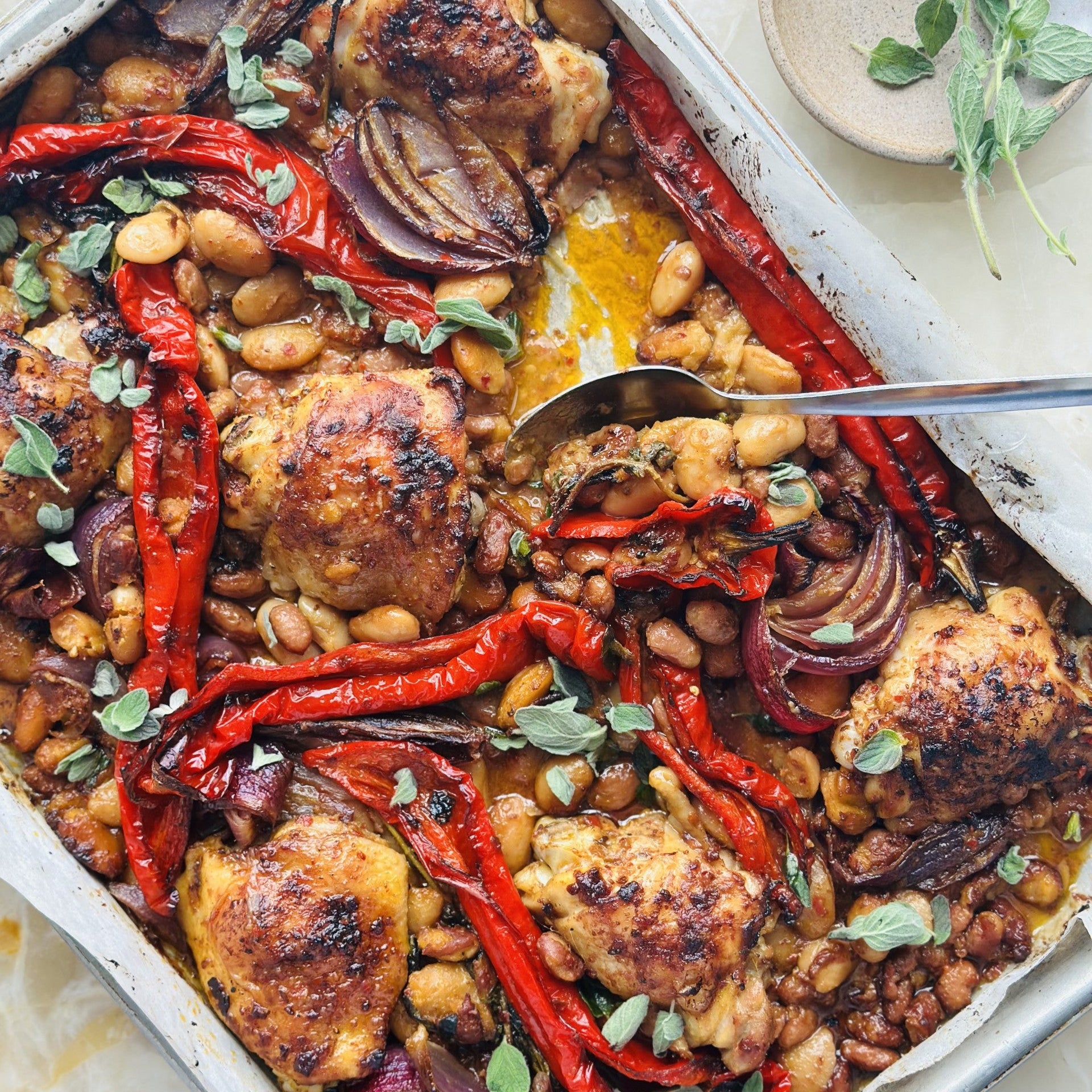 Orange harissa chicken traybake