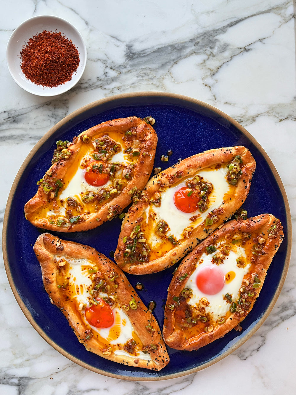 Adjaruli khachapuri with aleppo chilli and spring onion butter