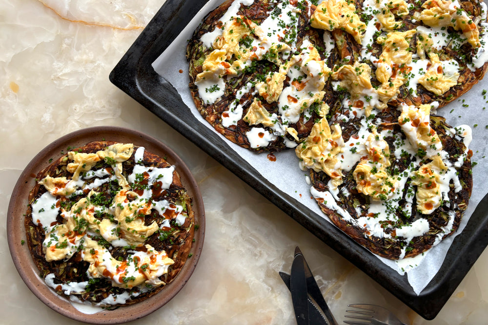 Cabbage blini with eggs, hot sauce & kefir drizzle
