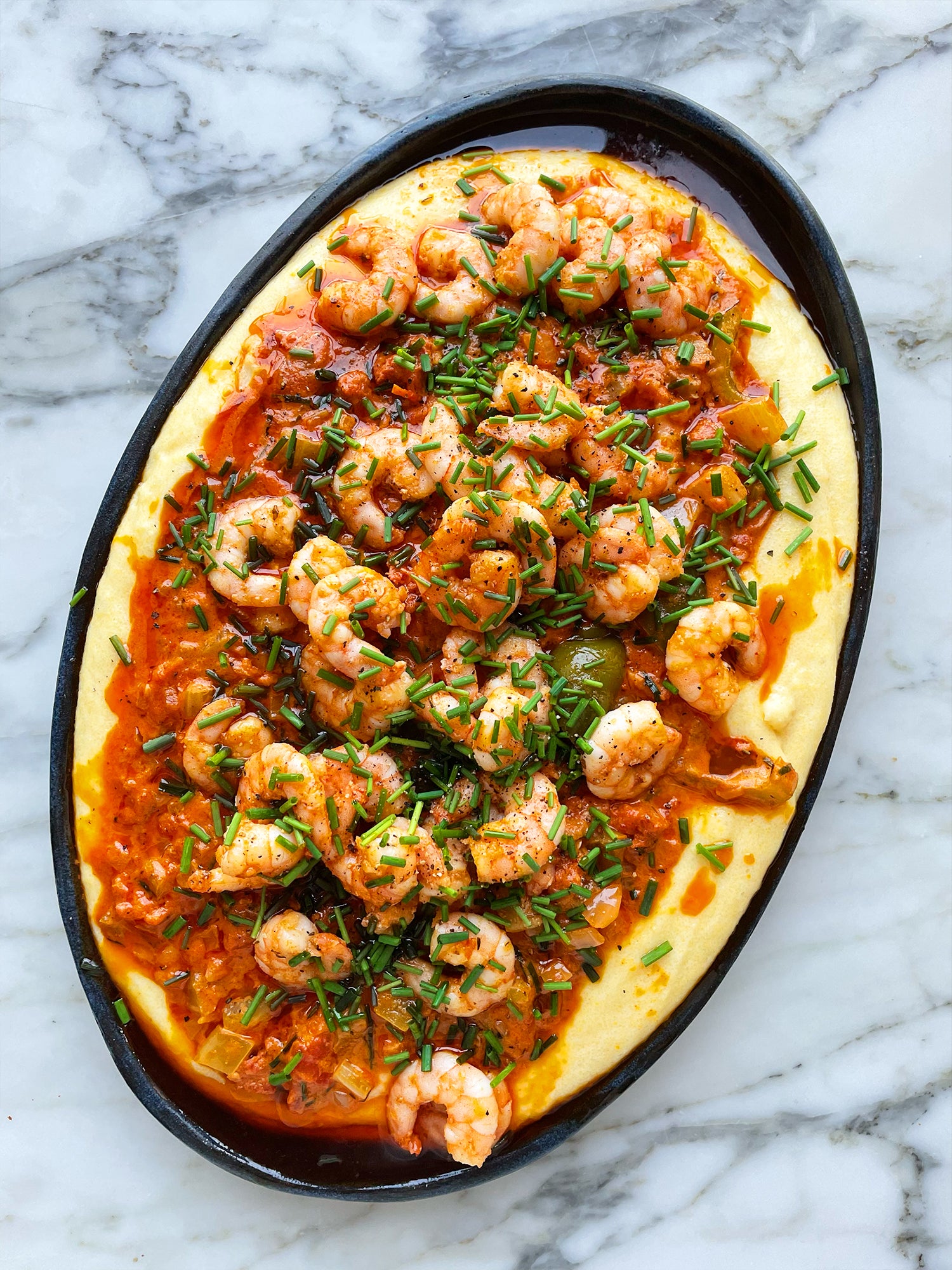 Cajun prawns, creamy tomato sauce and cheesy polenta