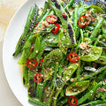 Charred green beans with anchovy dressing and seed dukkah