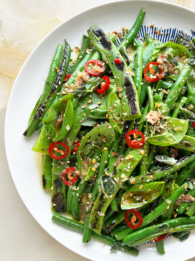 Charred green beans with anchovy dressing and seed dukkah