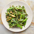 Charred peas with lemon and parmesan dressing