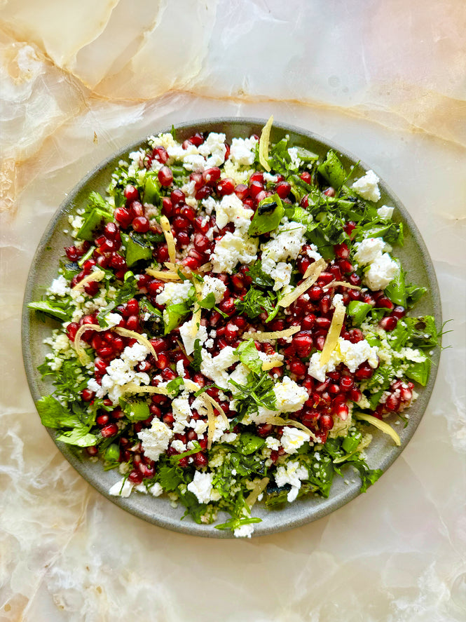 Charred sugar snap, pomegranate and couscous salad