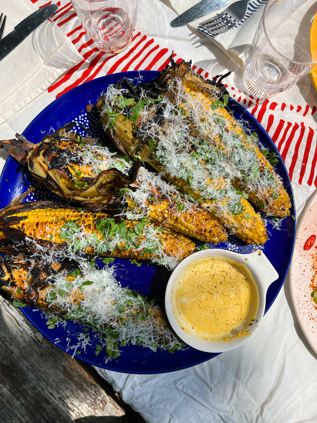 Corn grilled in its husk with creamy pecorino dressing