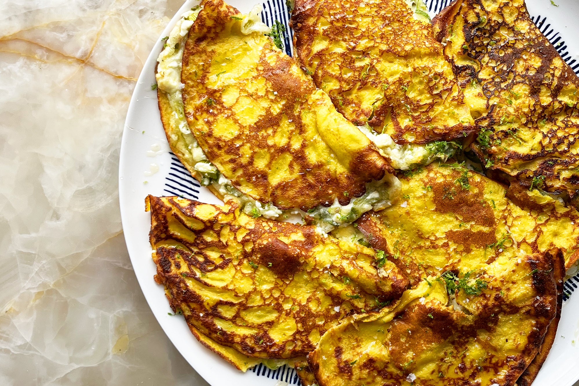 Feta and mozzarella cachapas with honey and lime