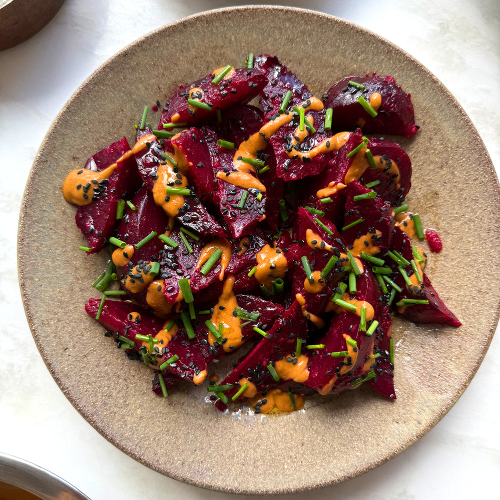 Gingery beetroot with peanut dressing, black sesame and chives