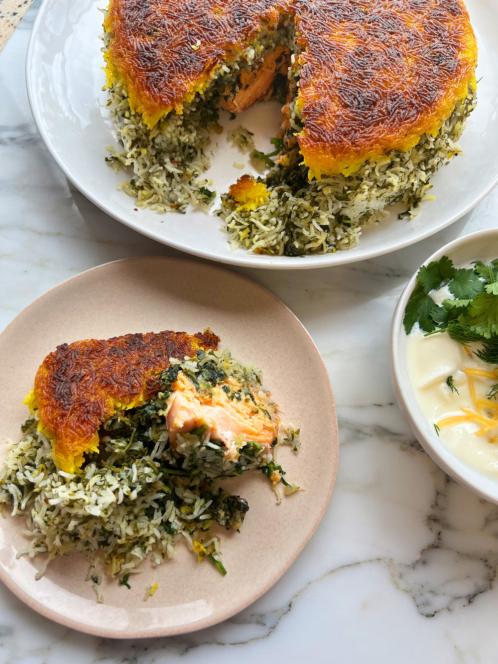 Herby tahdig with trout and preserved lemon yoghurt