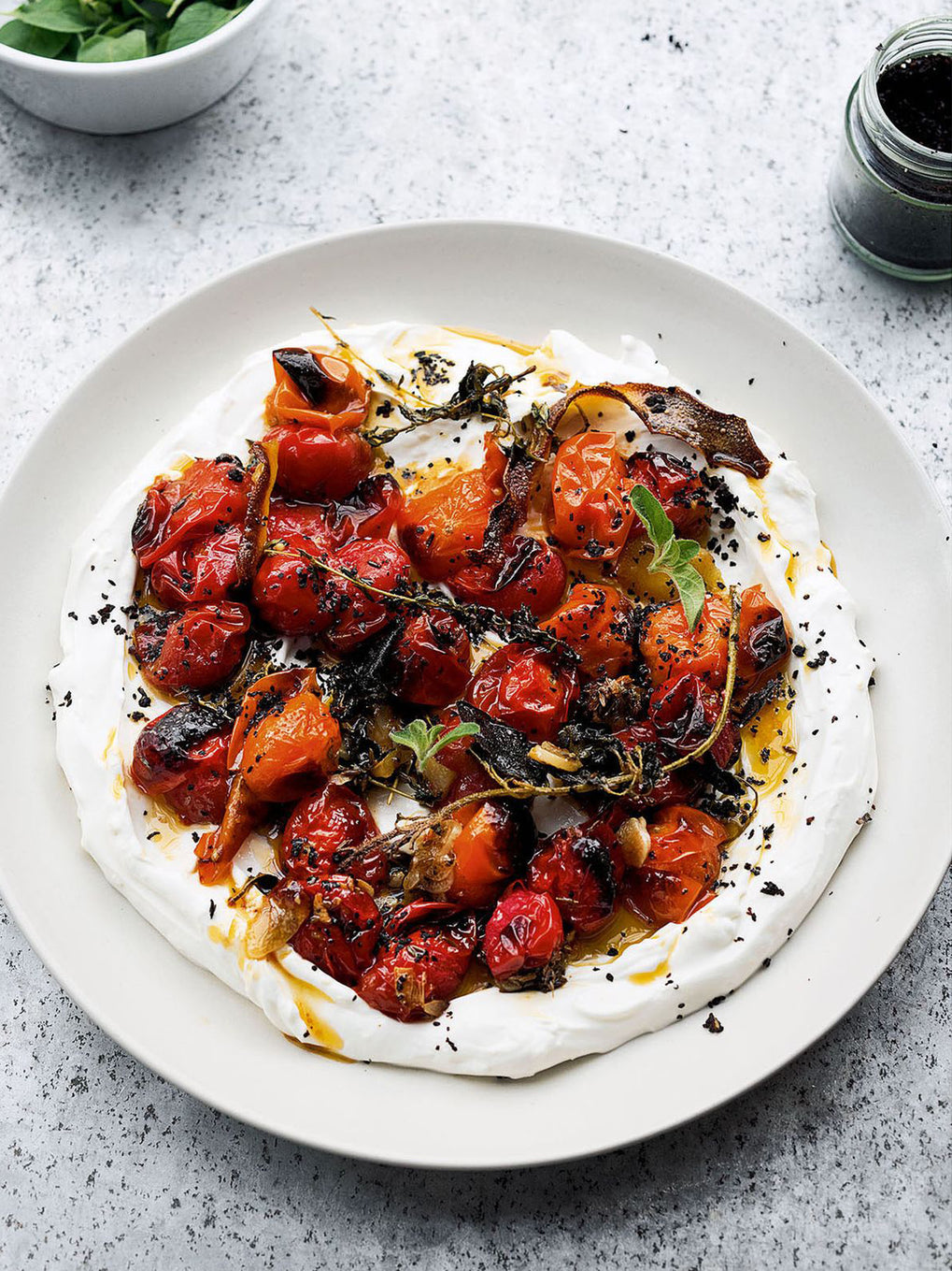 Hot charred cherry tomatoes with cold yoghurt