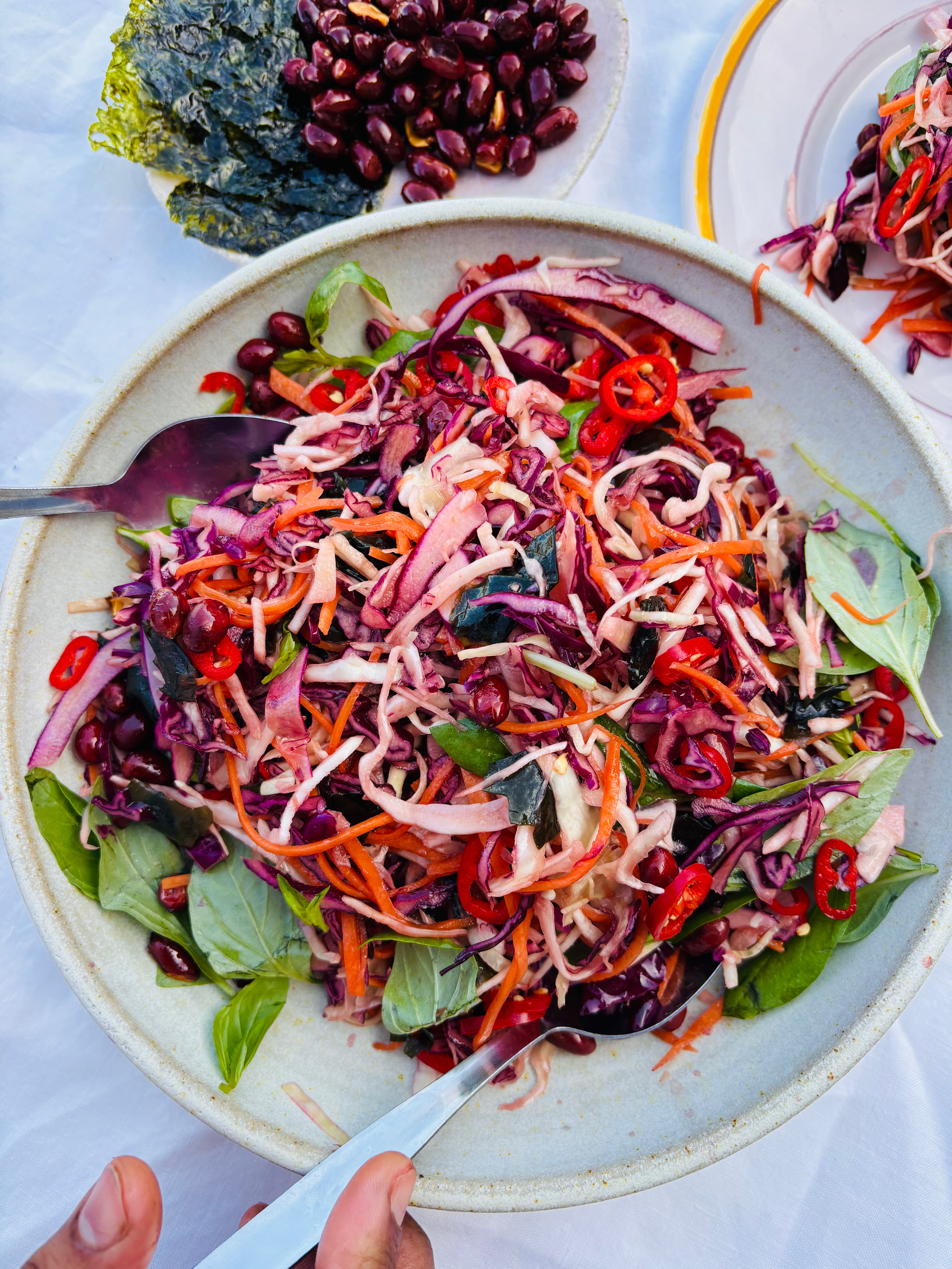 Yuzu dressed slaw with fried peanuts and Thai basil