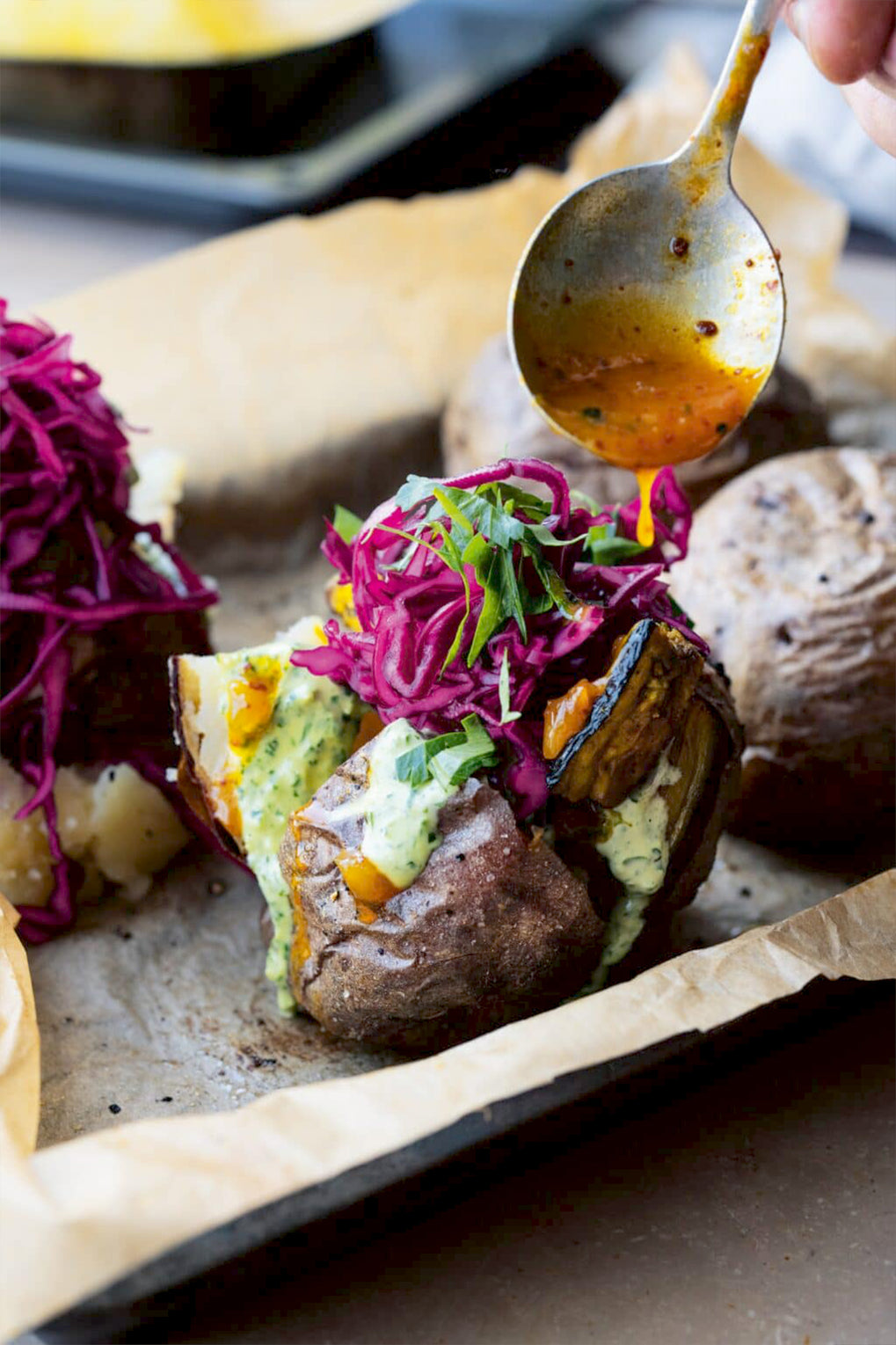 Jacket potatoes with aubergine and green tahini