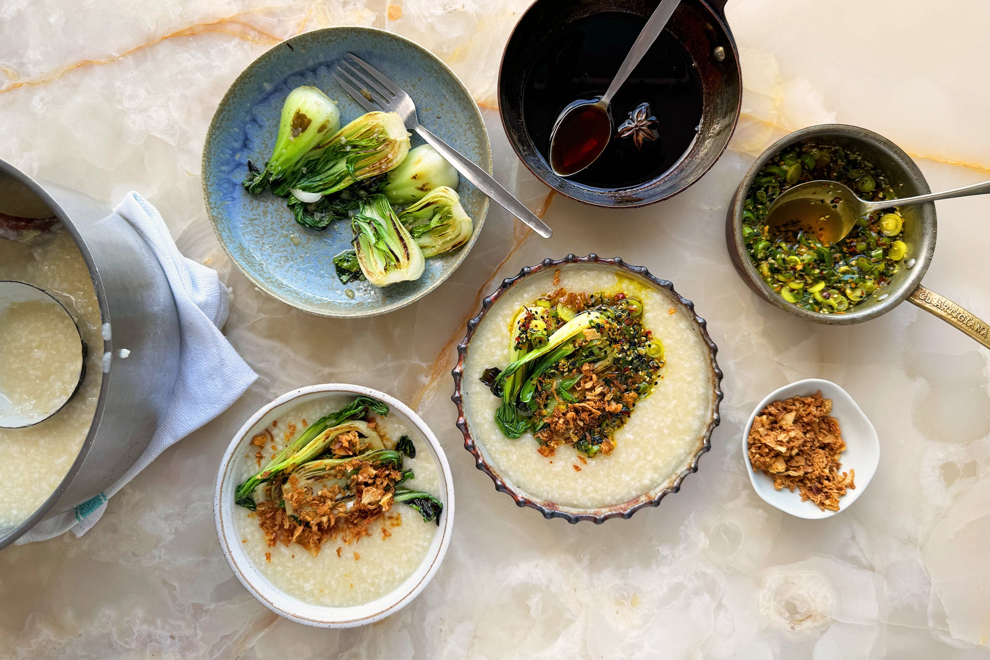 Jook with garlicky choi sum and turmeric oil