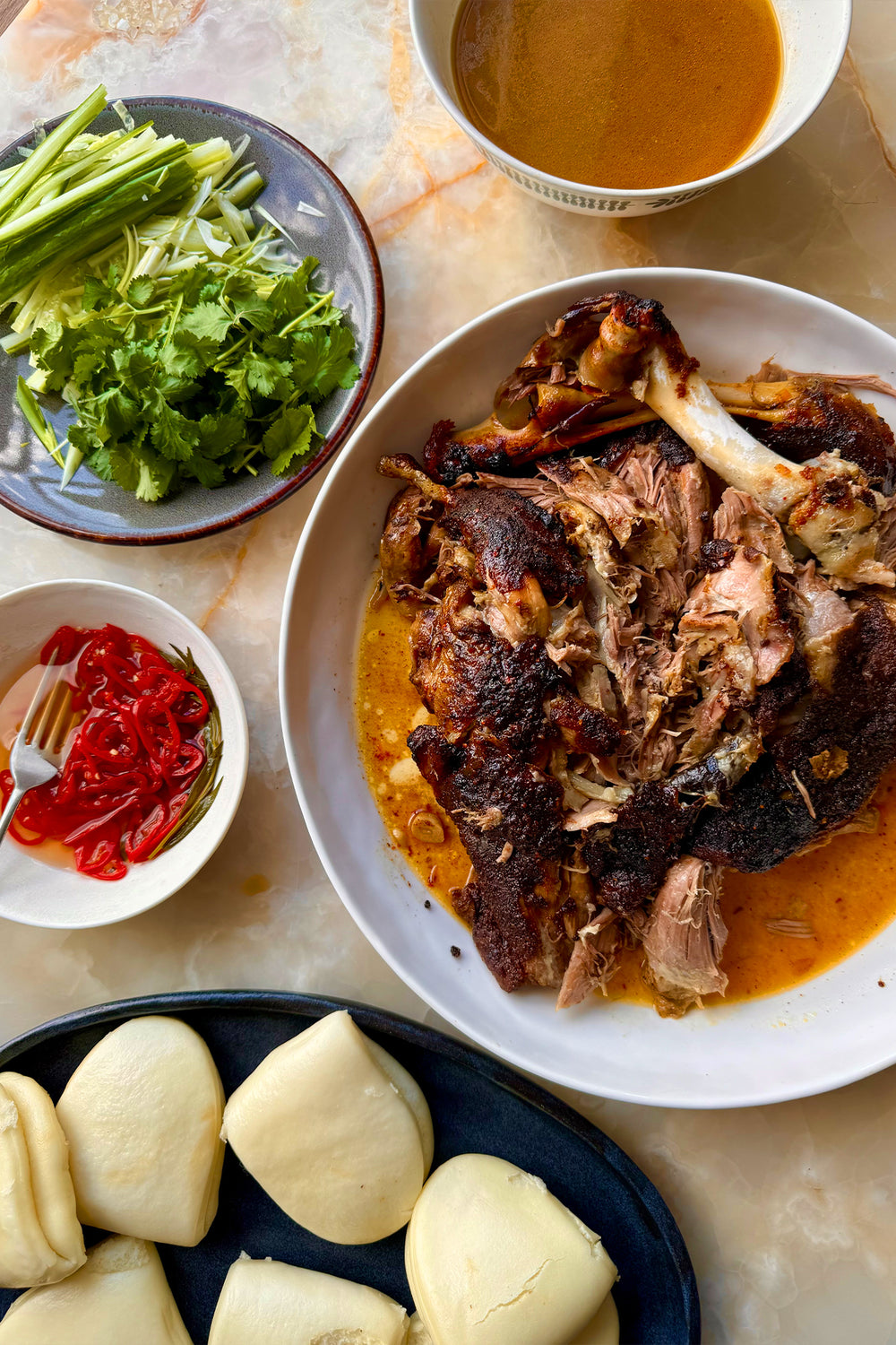 Sticky Lamb Bao with Pickled Chilli and Coriander 