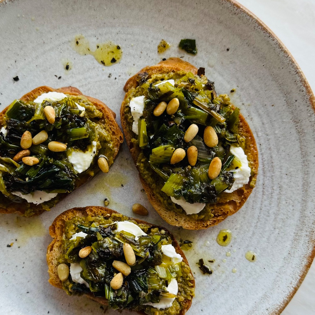 Miso pesto crostini with charred spring onion salsa