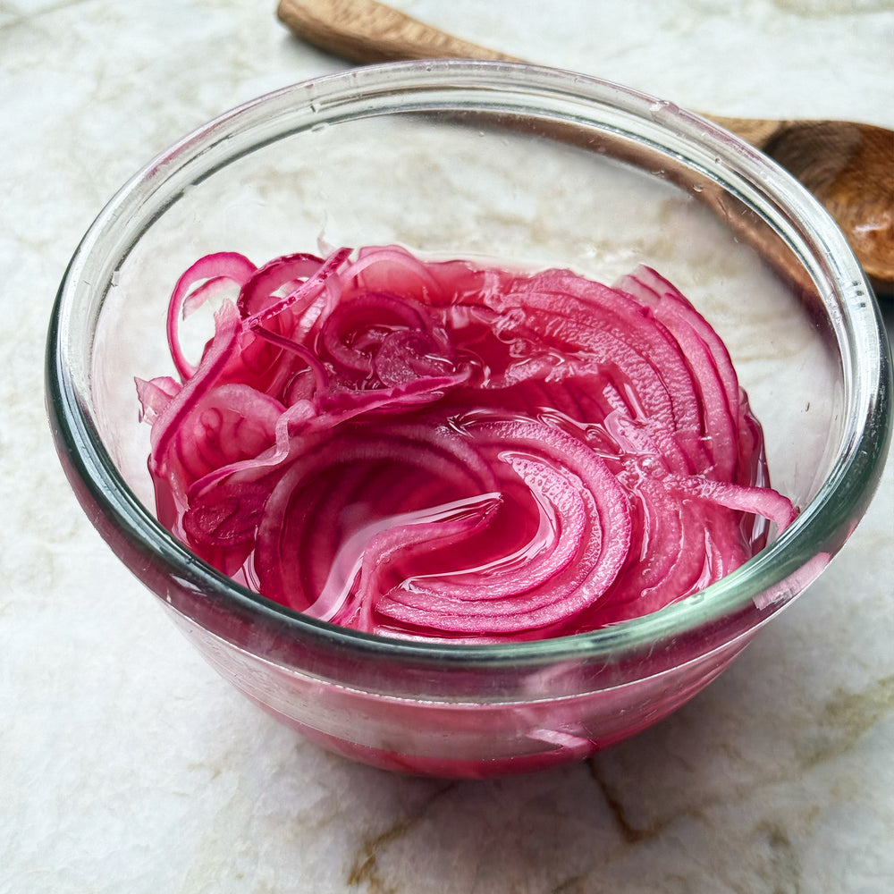Pea and artichoke dip with pickled onions