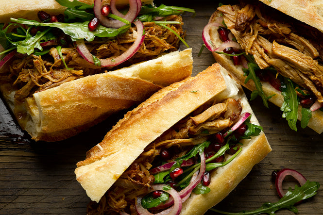 Pulled pork sandwich with pomegranate salad