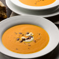 Pumpkin, saffron and orange soup with caramelised pumpkin seeds