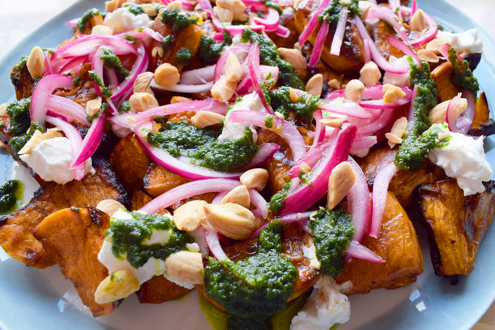 Roast sweet potatoes with pickled onions, coriander and goat's cheese