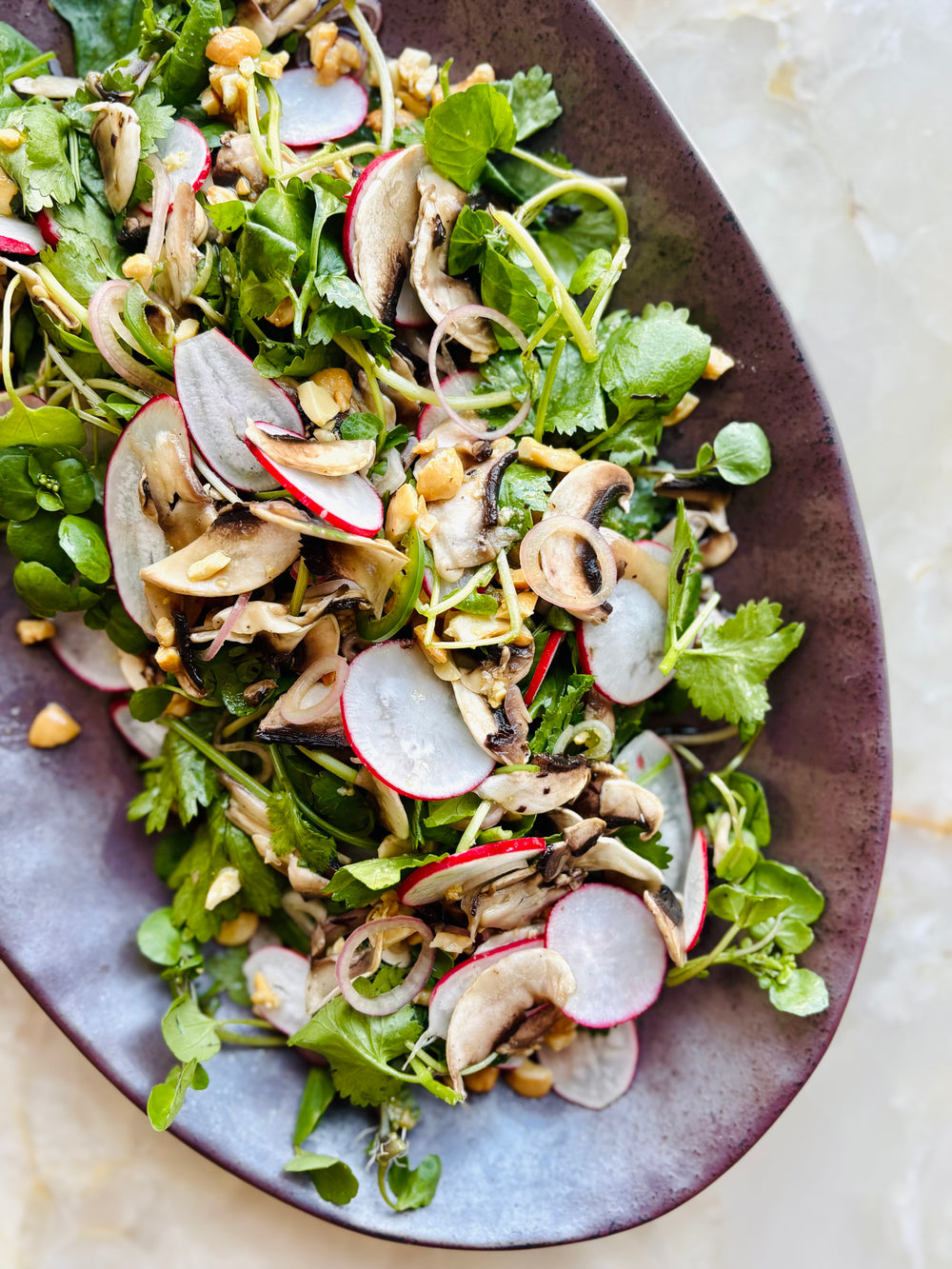 Sliced mushroom, salted cashew and yuzu salad