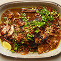 Slow-cooked lamb shoulder with fig and pistachio salsa