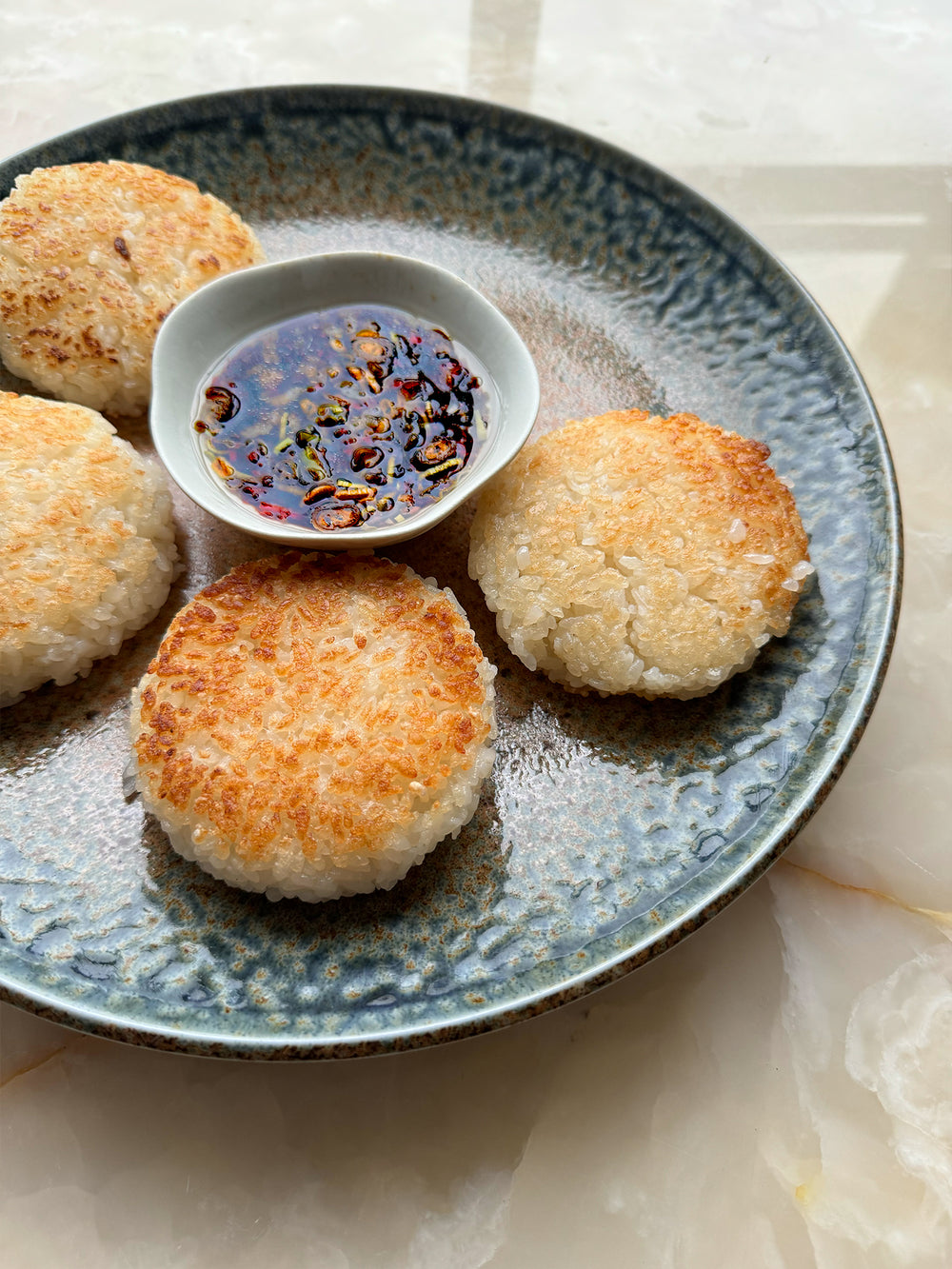 Sushi rice cakes with chilli & spring onion dipping sauce | Ottolenghi