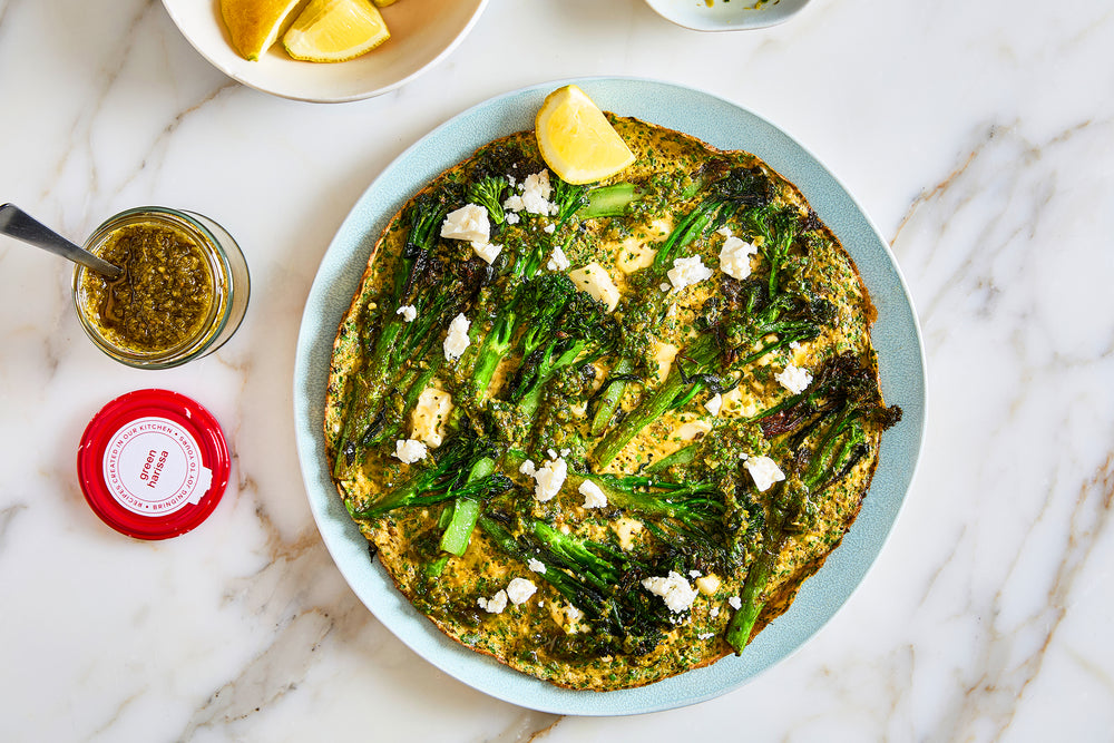 Tenderstem broccoli and green harissa stove-top frittata Recipe Image