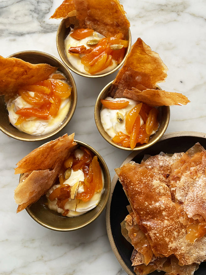Yoghurt cream with sticky apricots and filo wafer