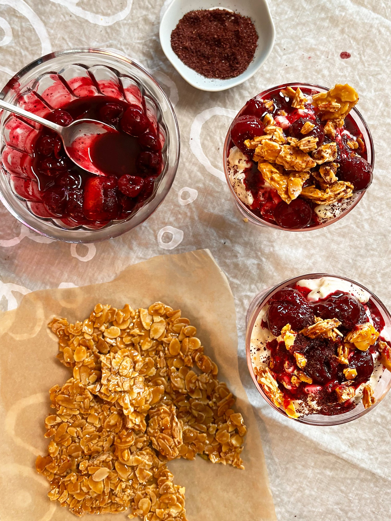 Danish rice pudding (Risalamande) with salted almond brittle and sour sumac cherries