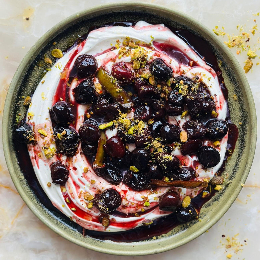 Roasted cherries with yoghurt cream and pistachio lime crumble